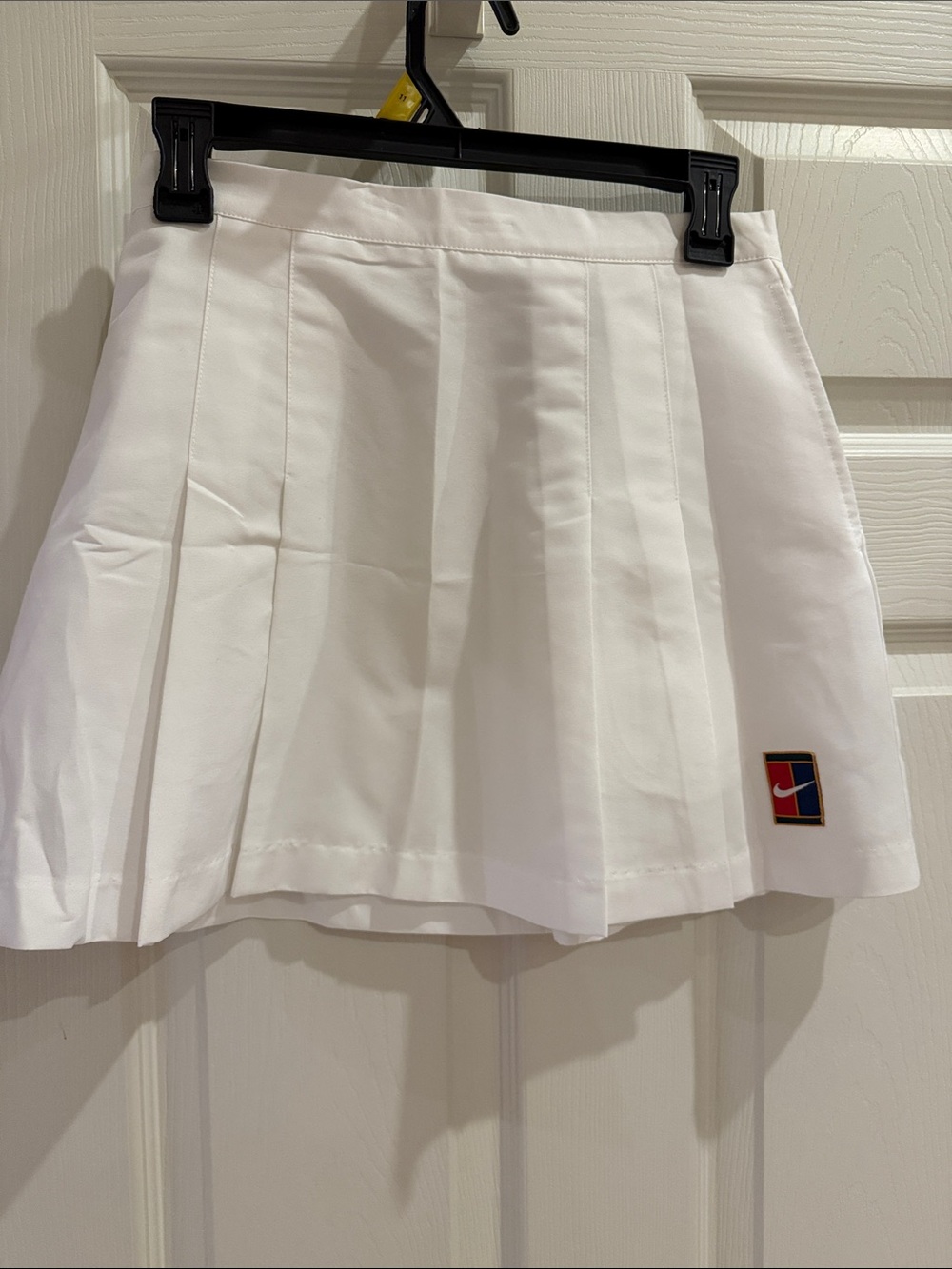 Nike White Pleated Tennis Skirt with Logo Patch, back zip and side pockets